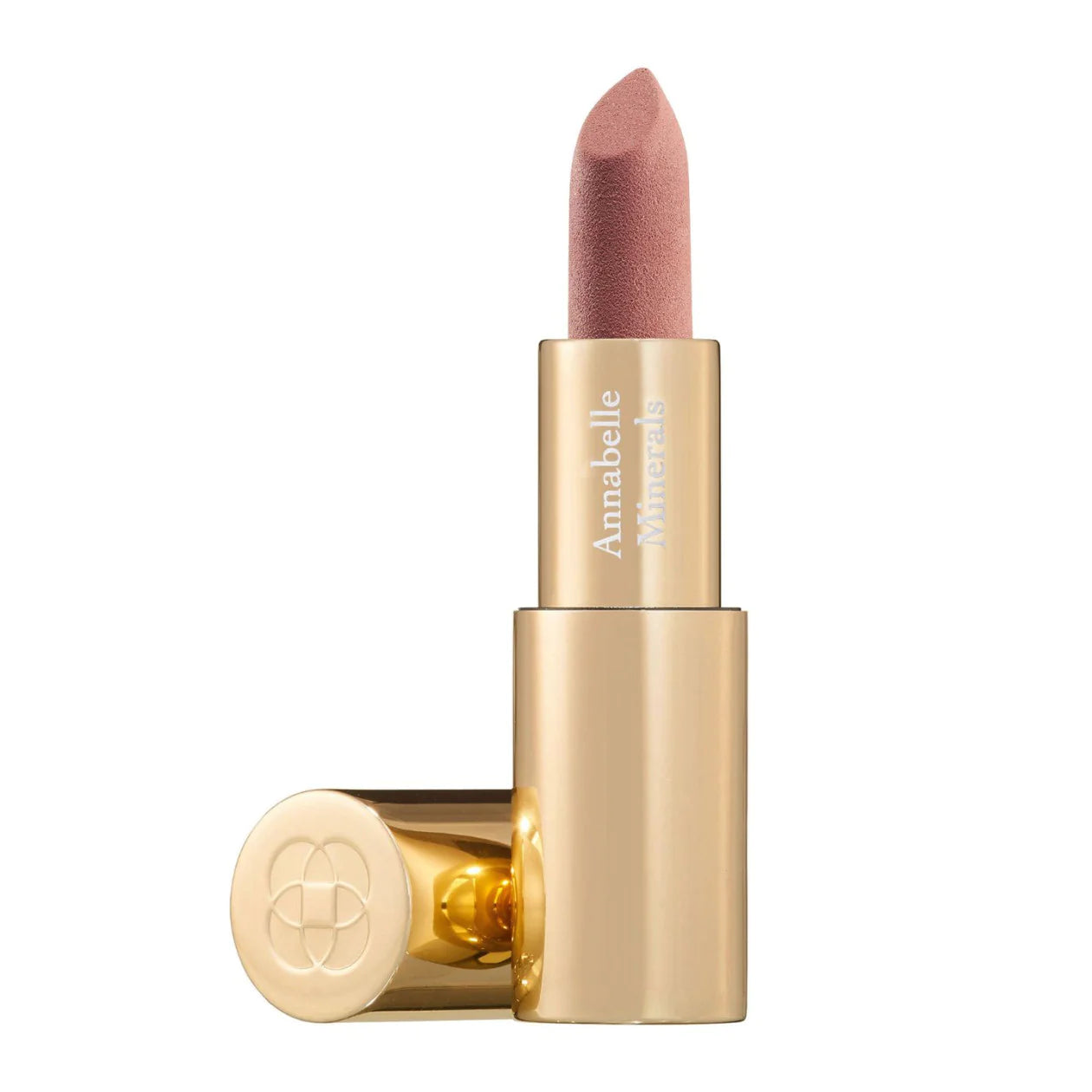 A gold-colored tube of Annabelle Minerals lipstick in a apricot sheer shade with the cap off, showing the product name on the side.