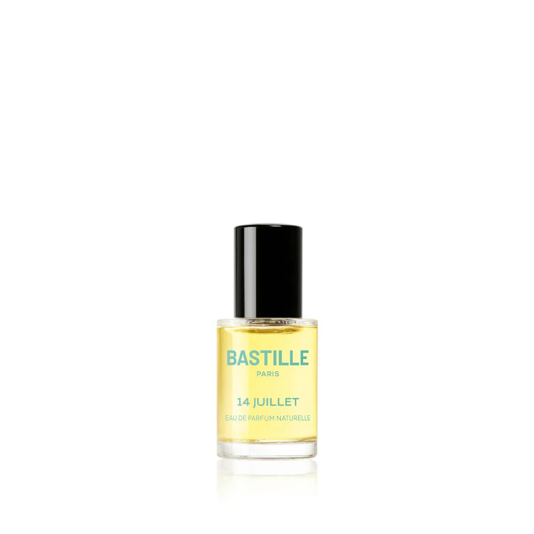 A bottle of 'Bastille 14 Juillet' EDP perfume next to its green box packaging, with the brand and product name visible.