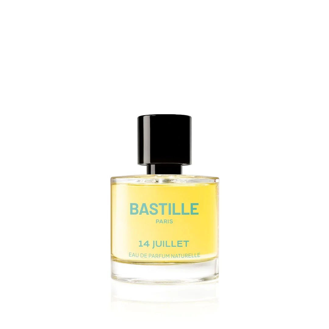 A bottle of 'Bastille 14 Juillet' EDP perfume next to its green box packaging, with the brand and product name visible.