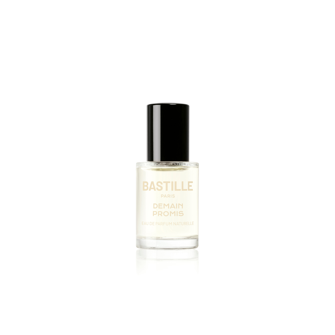 A bottle of 'Demain Promis EDP' by Bastille, placed next to its packaging box. The bottle is clear with a black cap, and the label has the brand name and product name printed on it.