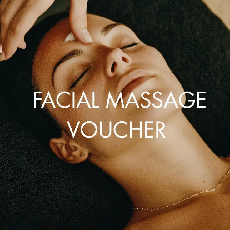 Facial massage being performed with text 'Facial Massage Voucher' on a dark background