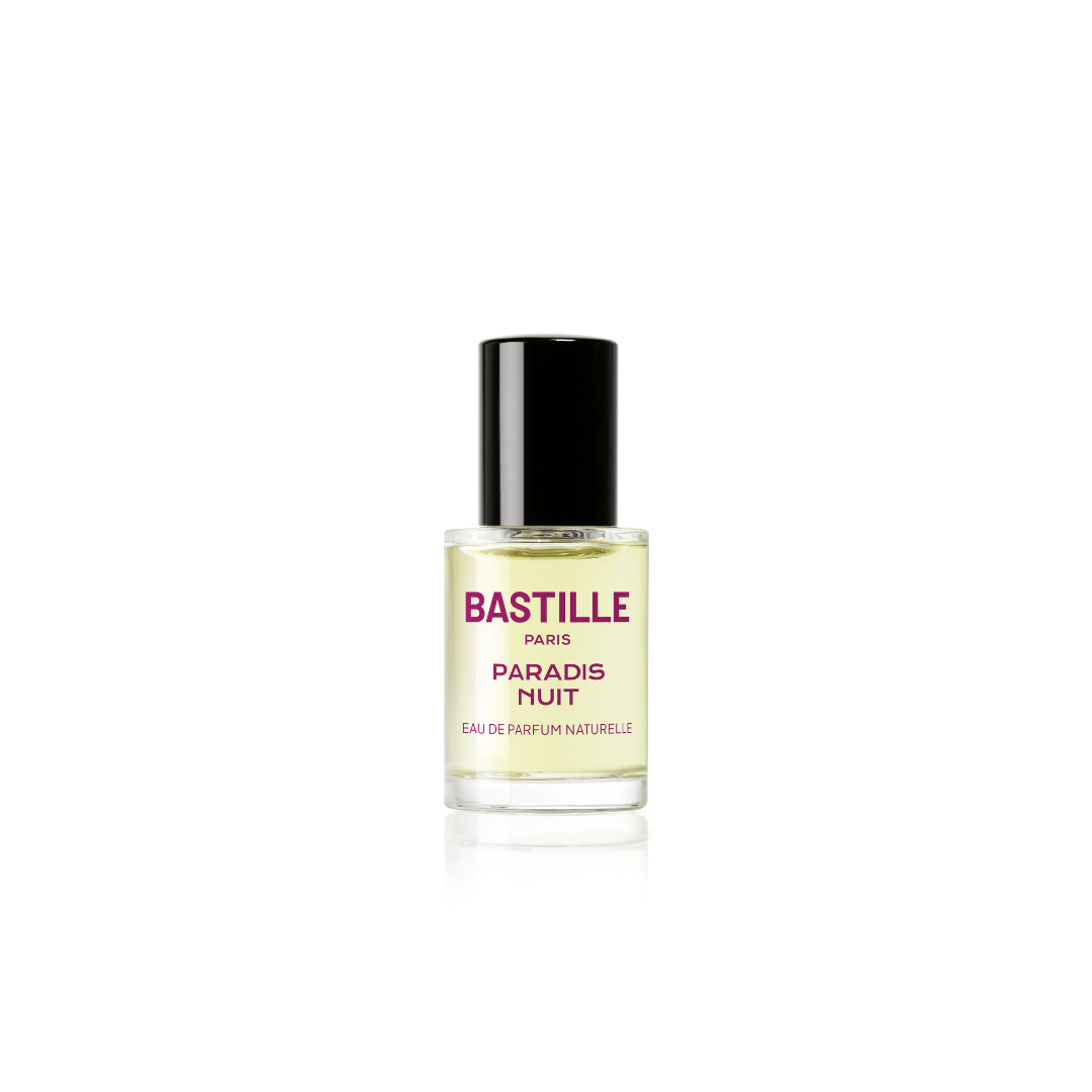 A bottle of 'Paradis Nuit' EDP by Bastille, with a purple box in the background. The bottle has a black cap and a label with white text on a purple background.