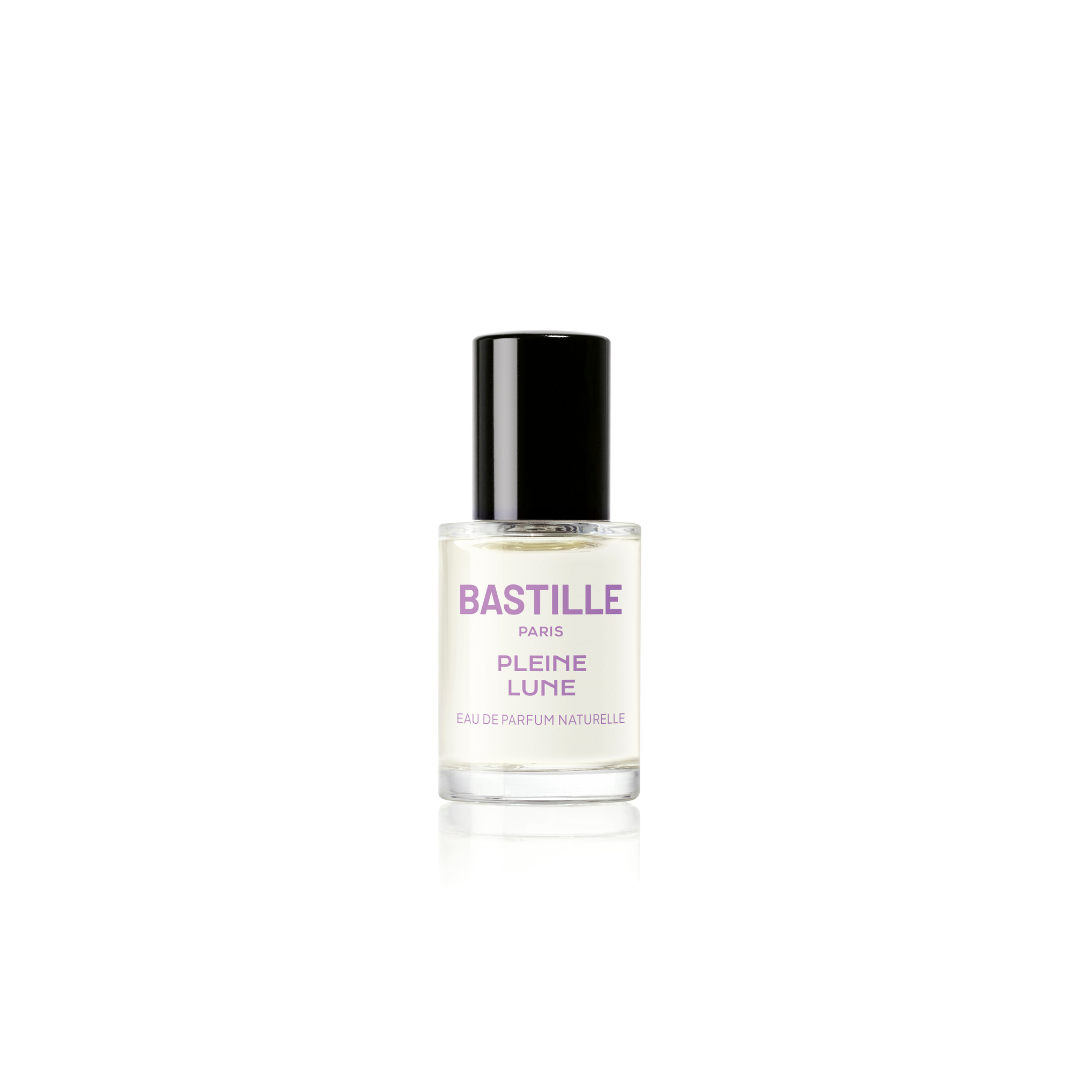 A bottle of Pleine Lune EDP perfume next to its purple box, with the brand name BASTILLE Paris visible.