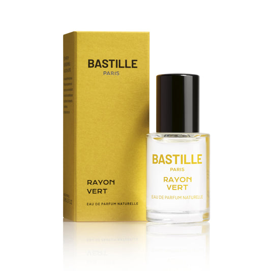 A yellow packaged perfume bottle labeled 'BASTILLE PARIS RAYON VERD' with a clear glass bottle showing the liquid inside. The box is in the background.