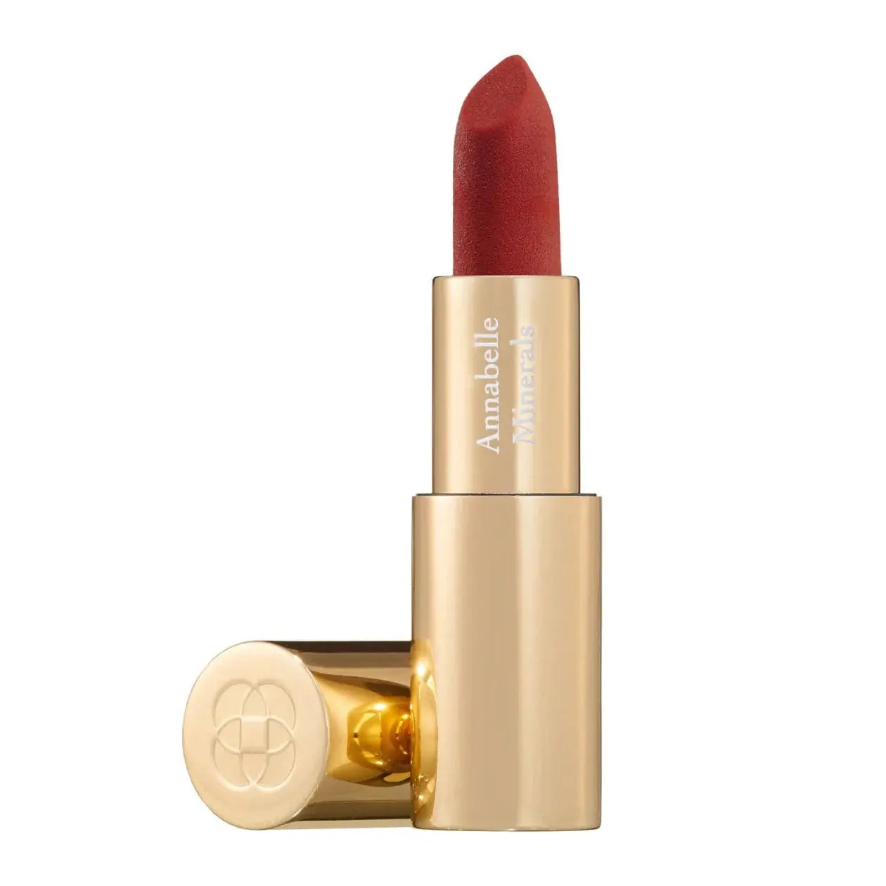 Red lipstick with gold casing on a white background