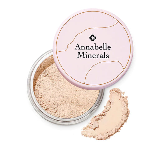Annabelle Minerals powder with a pink lid on a white background
