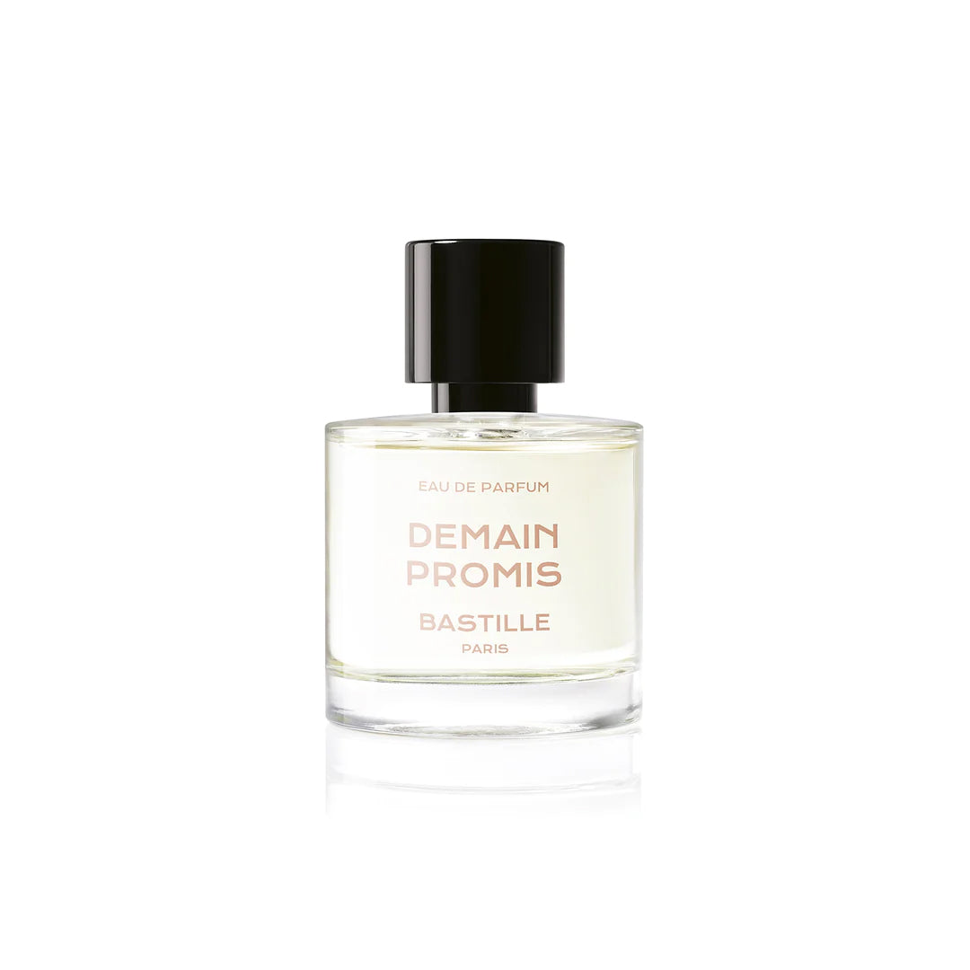 A bottle of 'Demain Promis EDP' by Bastille, placed next to its packaging box. The bottle is clear with a black cap, and the label has the brand name and product name printed on it.