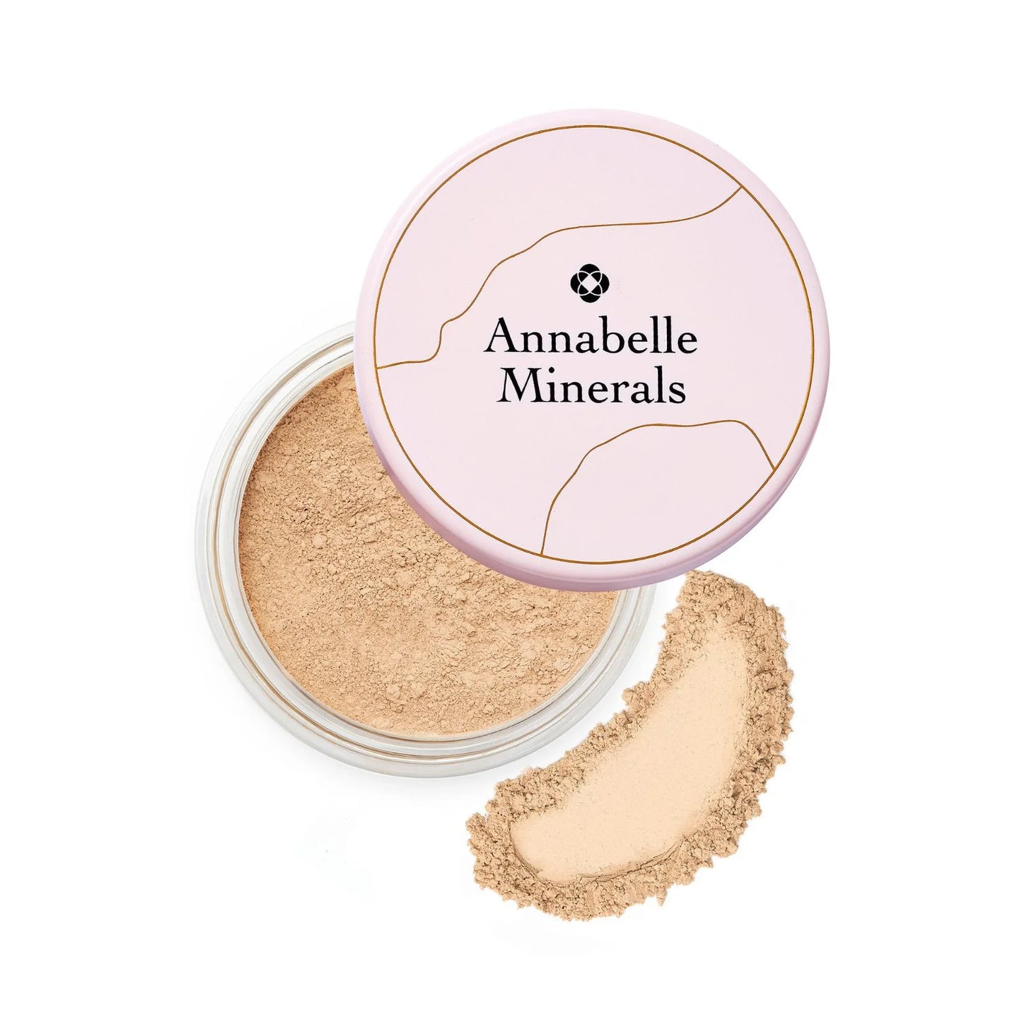 A jar of Annabelle Minerals Golden Sand Matte Mineral Foundation with the lid off, showing the light beige powder inside. A small amount of the foundation is also placed outside the jar to display its texture.