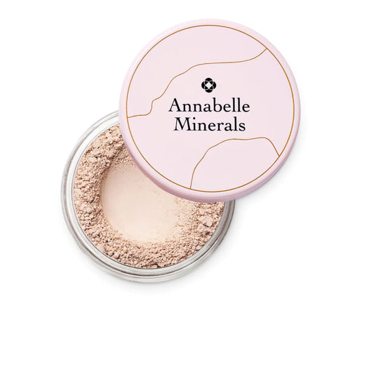 Annabelle Minerals powder with pink lid on a white background