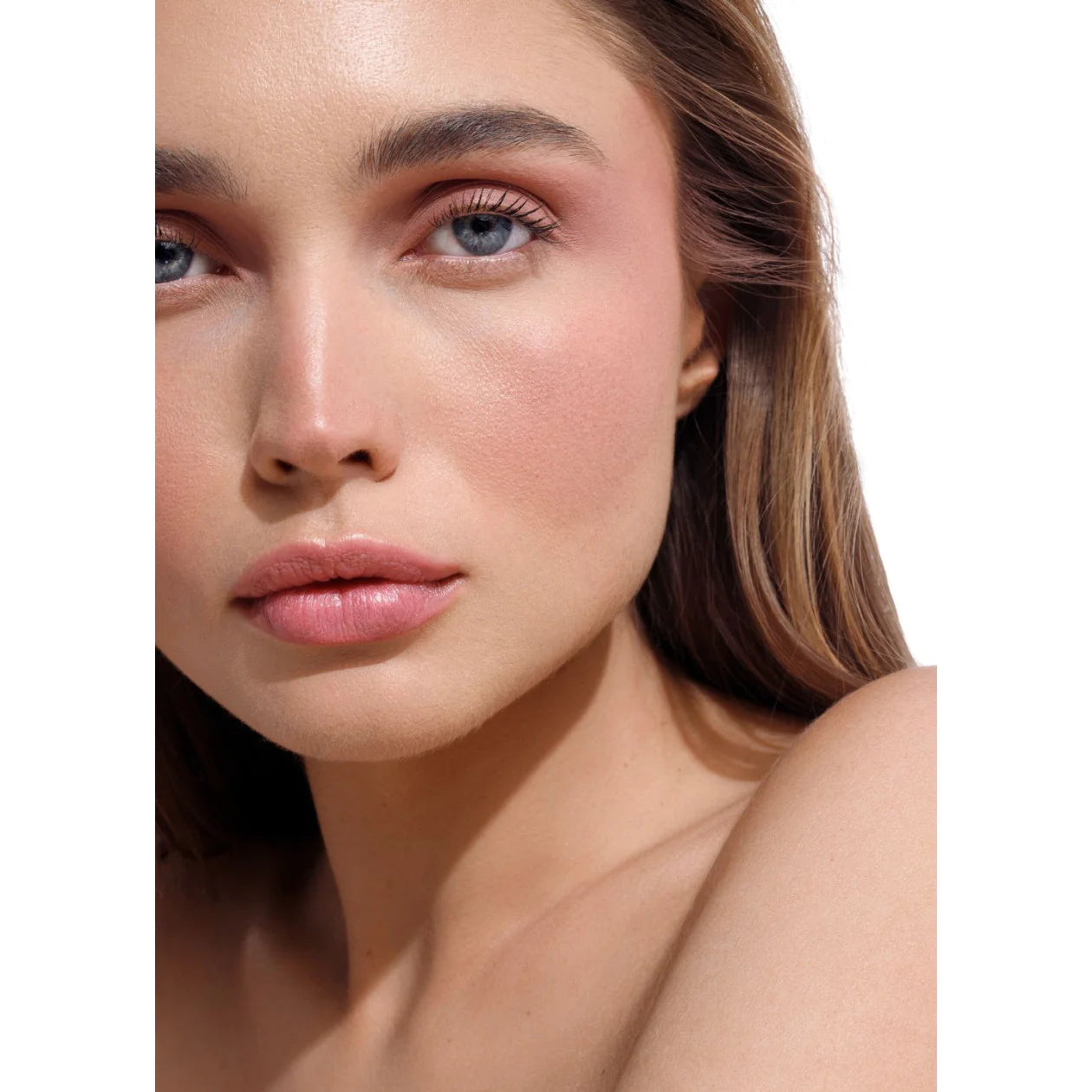 Close-up of a woman's face with a soft focus on her eyes and lips.