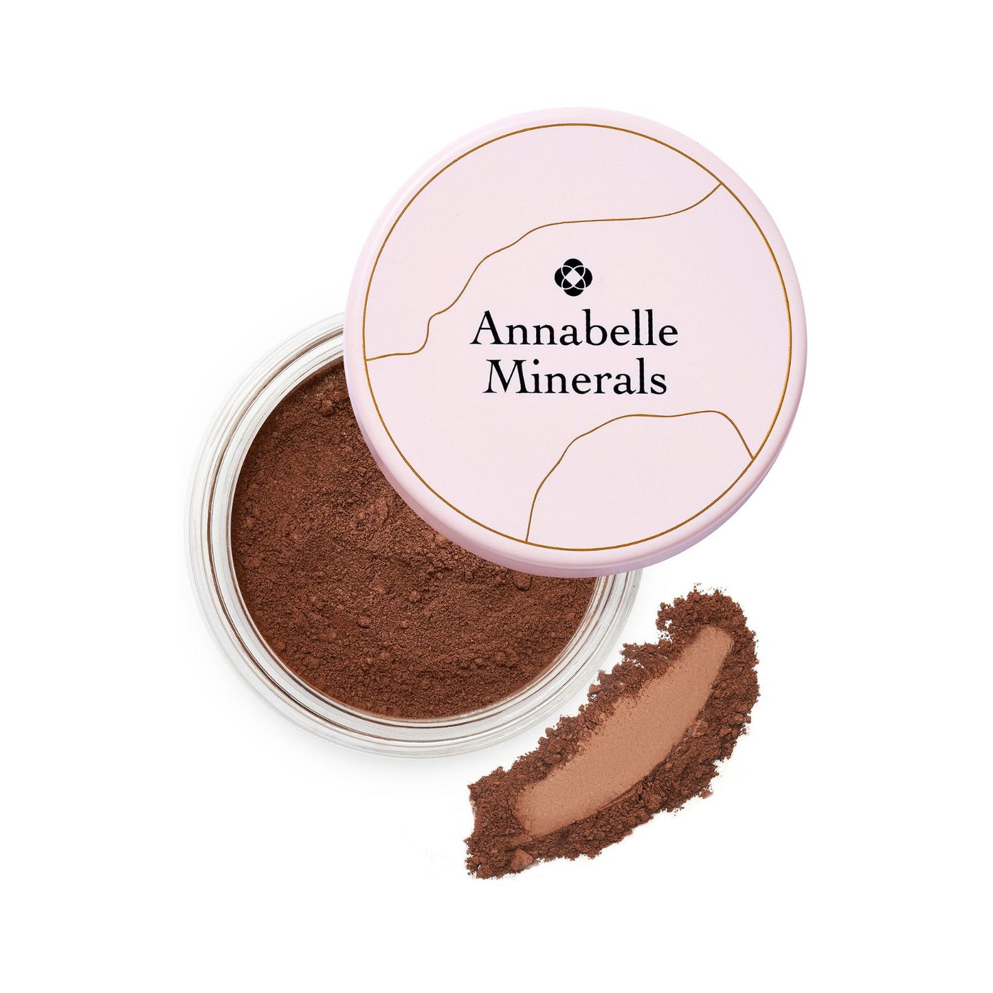 A jar of Annabelle Minerals natural deep matte mineral foundation with the lid off, showing the brown powder inside. A small amount of the foundation is also placed outside the jar to display its texture.