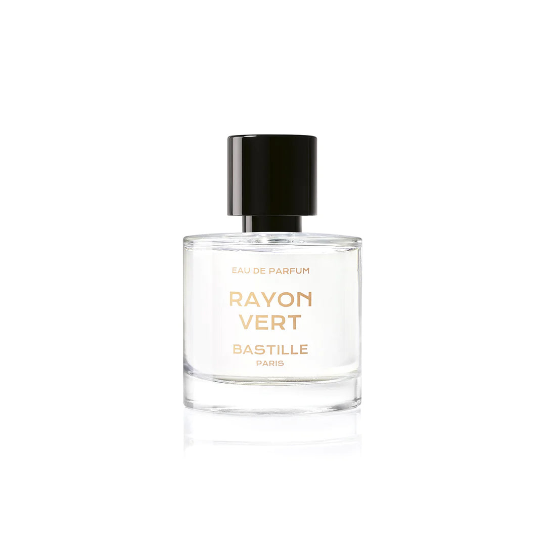 A yellow packaged perfume bottle labeled 'BASTILLE PARIS RAYON VERD' with a clear glass bottle showing the liquid inside. The box is in the background.