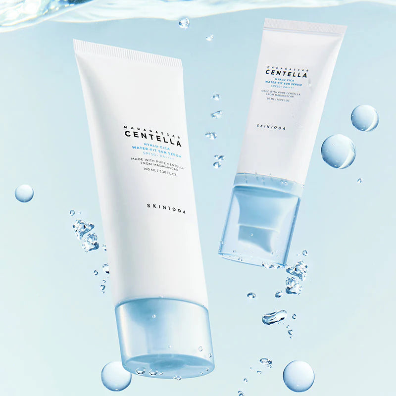 Two skincare products with water droplets and bubbles on a light blue background