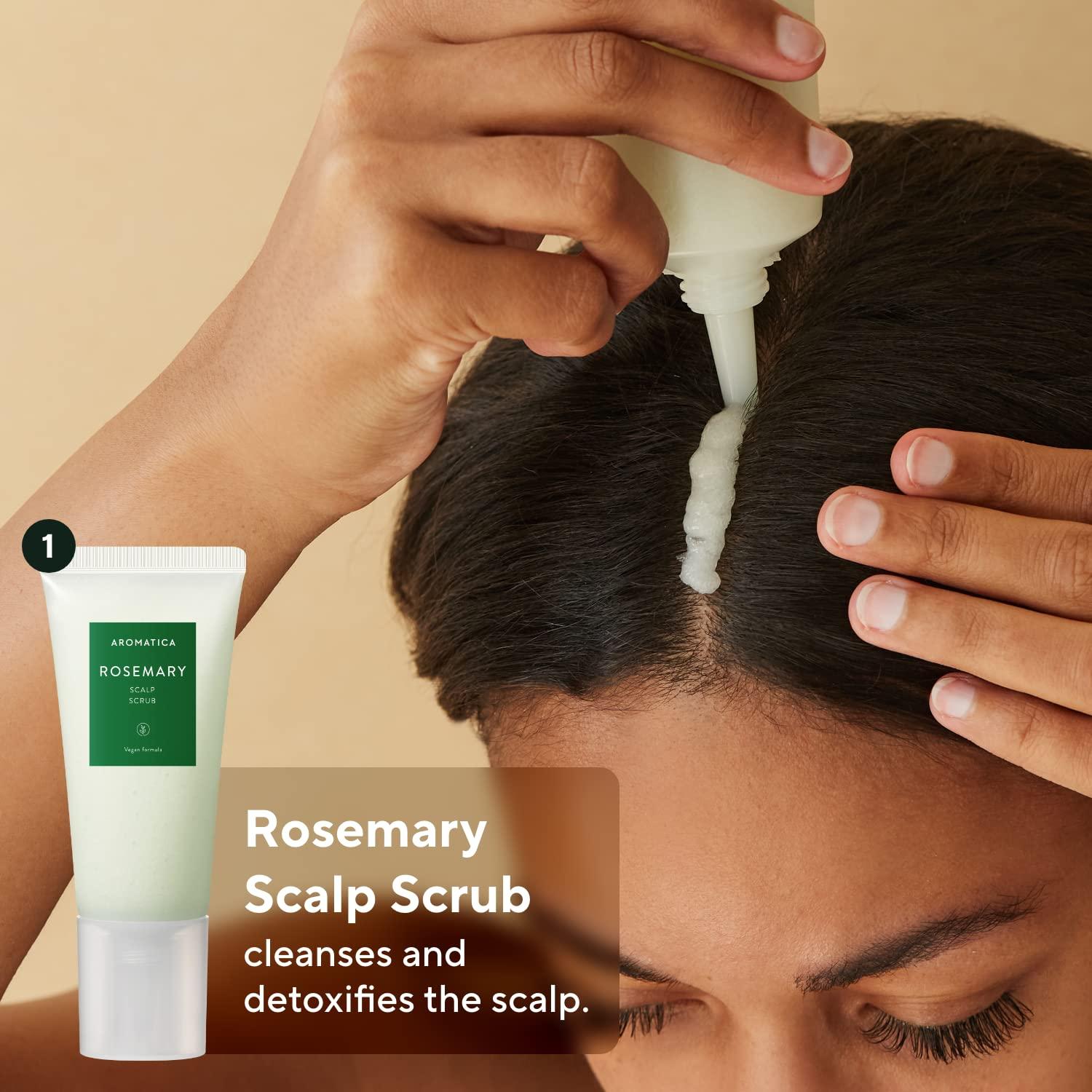 Person applying Rosemary Scalp Scrub to their scalp with a beige background