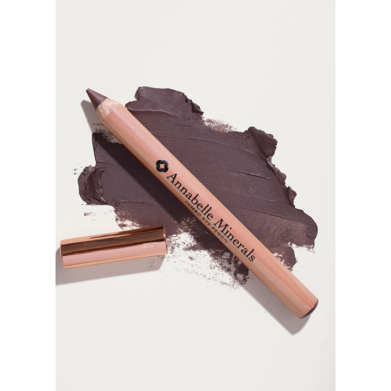 Lip liner pencil with brown shade and visible brand 'Annabelle Minerals' on a light background.